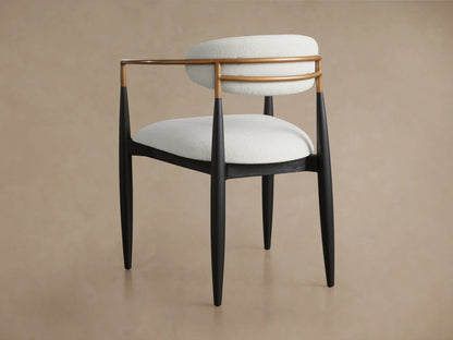 Front view of Jagger Dining Arm Chair featuring white upholstered seat and backrest, with a light brown frame and black legs.