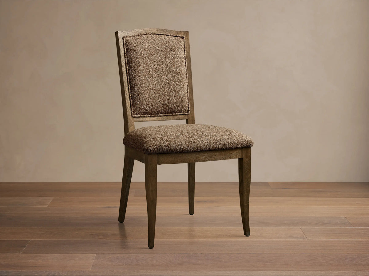 Front view of the Jeannine Upholstered Camel Back Dining Side Chair with an oak frame and brown tweed upholstery.