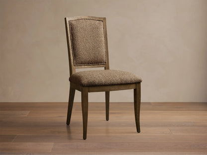 Front view of the Jeannine Upholstered Camel Back Dining Side Chair with an oak frame and brown tweed upholstery.