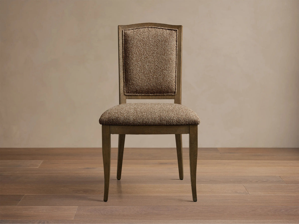Front view of the Jeannine Upholstered Camel Back Dining Side Chair with an oak frame and brown tweed upholstery.