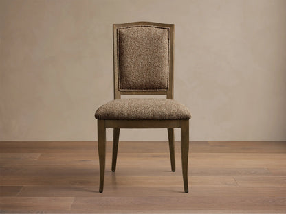 Front view of the Jeannine Upholstered Camel Back Dining Side Chair with an oak frame and brown tweed upholstery.
