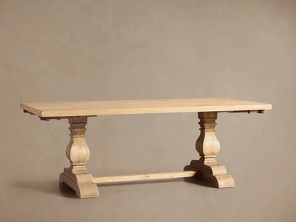 Light natural oak Kensington Dining Table with two ornate pedestal bases. Extension leaves are partially pulled out at both ends.