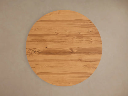 Top view of a round Kensington Round Reclaimed Dining Table with a natural light brown reclaimed French oak veneer top, showing wood grain and knots.