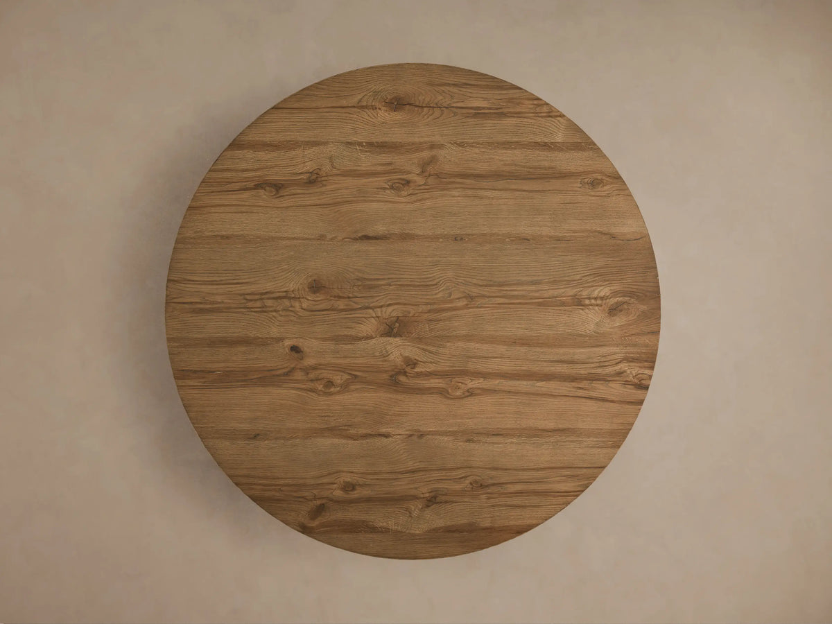 Kensington Round Reclaimed Dining Table with a French oak veneer top and a solid Finnish pine cross base, displaying natural wood grain.