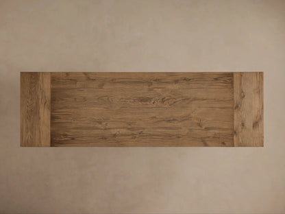 Kensington Reclaimed Dining Table with rustic wood grain tabletop, thick edge, and sturdy pedestal base on a neutral background.