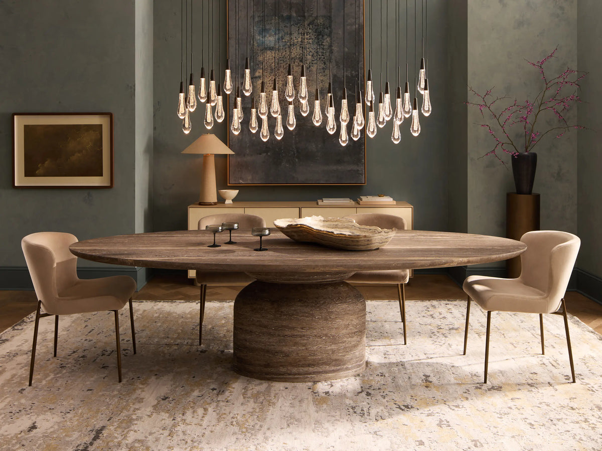 Kirsten Dining Chair with white upholstered seat and backrest, featuring slim black iron legs on a wooden floor.