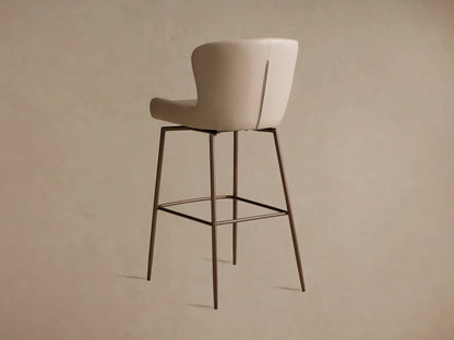 Kirsten Faux Leather Swivel Stool with cream upholstery, side view. Brown powder-coated iron frame and legs, 360-degree swivel.