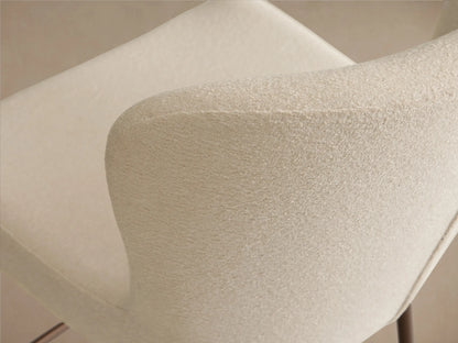 Kirsten Swivel Stool in side view, features a white cushioned seat with a curved backrest, iron frame, and powder-coated legs.