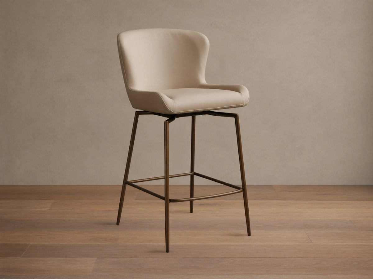 Kirsten Faux Leather Swivel Stool with beige cushioned seat and back, on sleek powder-coated black iron legs, on wooden floor.