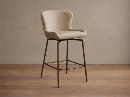 Kirsten Faux Leather Swivel Stool with beige cushioned seat and back, on sleek powder-coated black iron legs, on wooden floor.