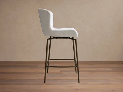 Kirsten Swivel Stool with a white cushioned seat and backrest, mounted on sleek, powder-coated iron legs.