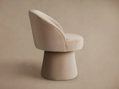 Lindsay Swivel Dining Chair in beige fabric, featuring a curved backrest and cushioned seat, angled view showing fabric texture.
