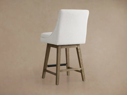 Lunden Swivel Stool in Fawn with a cushioned seat in light beige fabric and a gently curved backrest on a wooden base.