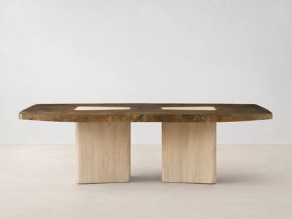 Marea Dining Table with a mottled dark bronze top and two light wood bases, featuring two light rectangular inlays, on wood floor.