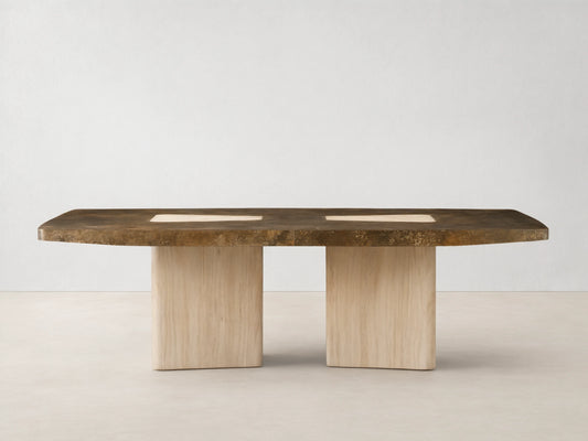 Marea Dining Table with a mottled dark bronze top and two light wood bases, featuring two light rectangular inlays, on wood floor.