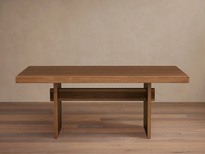 Mihaela Dining Table made from Romanian oak and spruce with walnut veneer. Features a sleek rectangular top and unique cross-beam legs on wooden floor.