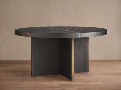 Mihaela Round Dining Table, dark wood with visible grain & brass accent line. Angled view of round top & cross-shaped base.