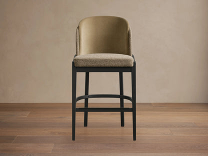 Mena Stool with Crypton Banks Taupe upholstery, featuring a textured, taupe fabric seat and back, with black wood frame.