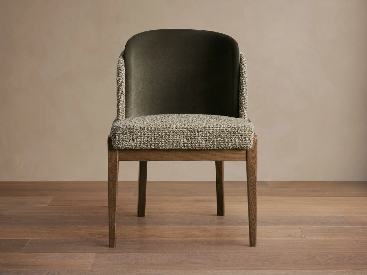 Mena Dining Chair, dark ash wood frame. Seat and outer back in light textured fabric, inner back in dark olive velvet.
