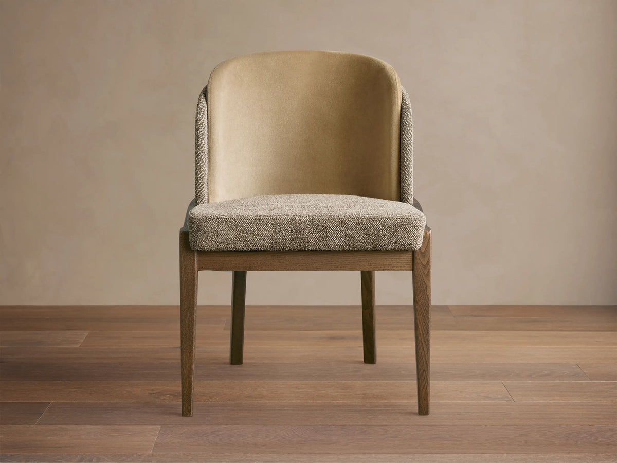 Mena Dining Chair: dark ash frame with tapered legs. Light tan inner back, speckled beige fabric seat & outer back.