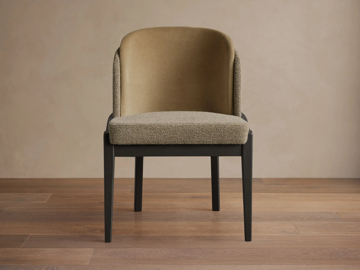 Casual chair: dark wood frame, textured beige seat, smooth tan inner back, textured beige outer back. On wood floor.