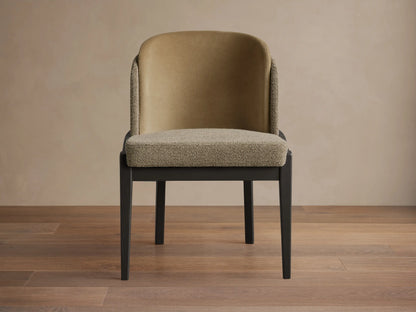 Casual chair: dark wood frame, textured beige seat, smooth tan inner back, textured beige outer back. On wood floor.
