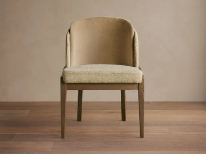 Front view of Mena Dining Chair with dark wood tapered legs and two-tone beige fabric upholstery, featuring a curved back.
