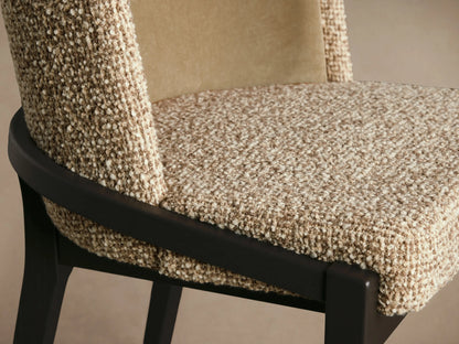 Mena Dining Chair: close-up of textured light brown seat, smooth tan back, and dark curved ash wood frame.
