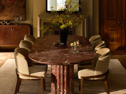 Mena Dining Chair: Dark ash frame with layered beige fabric backrest and light cream seat, angled on a wood floor.