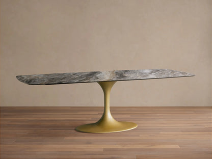 Vincenza Dining Table with Launette Base, featuring a calacatta marble-design ceramic top and gold steel base on wood floor.