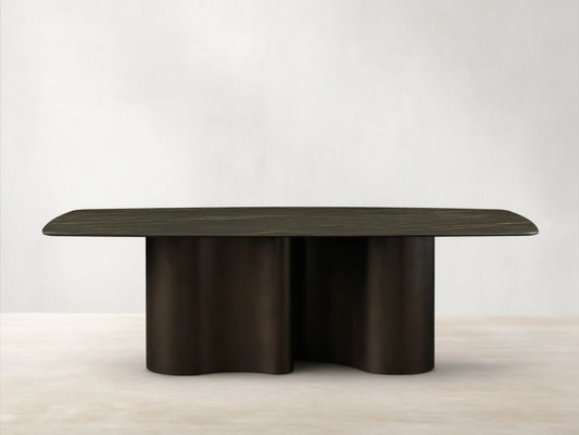 Front view of the Ortenzia Dining Table with a dark brown marble-patterned tabletop and a matte dark brown wavy base.