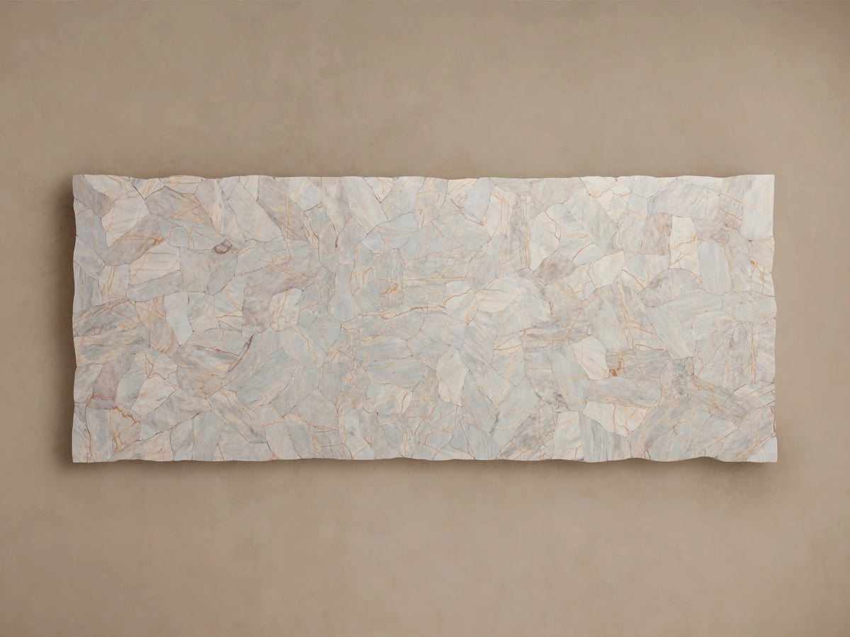 Close-up of Petra Dining Table corner showcasing hand-assembled petrified wood surface with natural patterns and textured edge on a metal base.