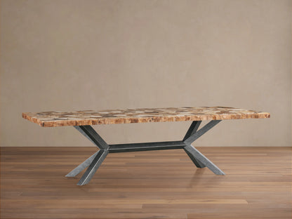 Petra Dining Table with a textured petrified wood surface and solid iron legs in a dark grey patina, set on a wooden floor.