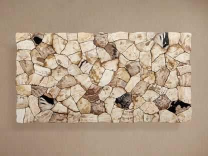 Edge view of the Petra Dining Table with a petrified wood surface. The tabletop shows a mix of dark and light tones with natural variations.