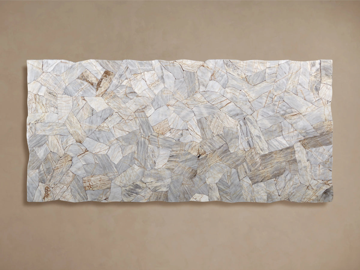 Close-up of the Petra Dining Table corner, showing a mosaic of light, polished petrified wood veneer with natural variations on a metal leg.