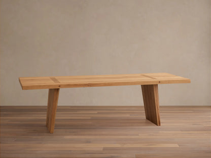 Panta Dining Table made of Romanian red oak wood, showing natural grain patterns, rectangular top, and angled legs on wooden floor.