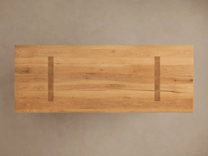 Panta Dining Table made of Romanian red oak, showing natural grain patterns, knots, and a polished, hand-stained finish.