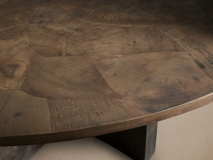 Close-up of Polanco Round Dining Table top, dark brown oyster-cut wood with intricate natural grain patterns and fine surface cracks.