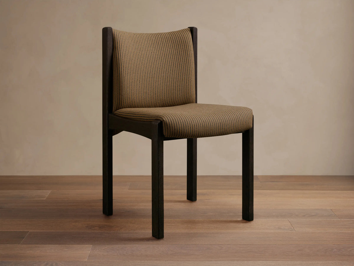 Front view of the Paradiso Dining Chair, featuring a light oak wood frame and vertically striped beige upholstery.