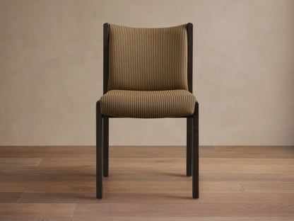 Front-side view of Paradiso Dining Chair, dark brown oak frame with tan fabric seat and backrest featuring thin vertical stripes.