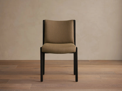 Rear view of the Paradiso Dining Chair, featuring a dark brown oak frame and a light brown vertically striped padded backrest and seat.