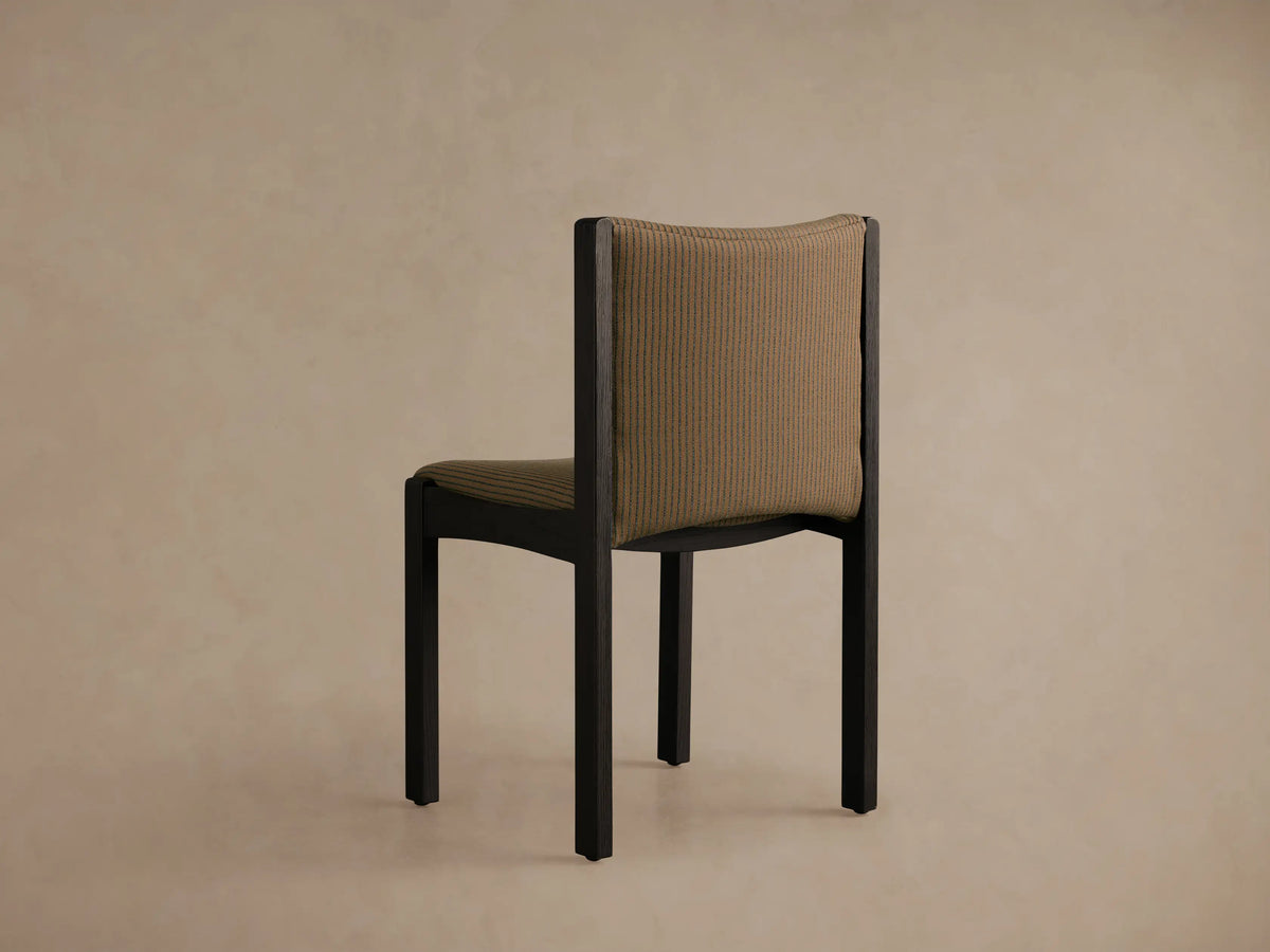 Close-up Paradiso Dining Chair, curved backrest & seat with tan fabric, thin green stripes, dark oak frame.