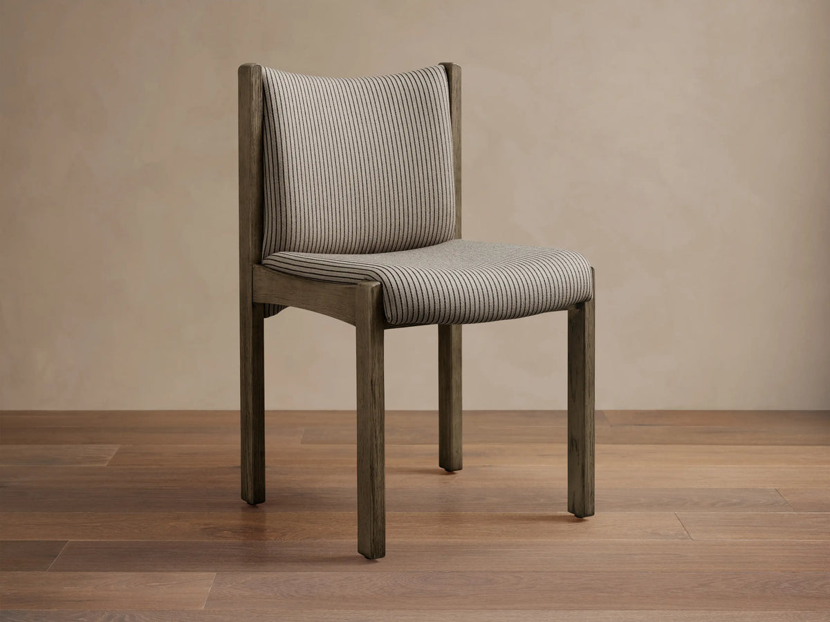 Paradiso Dining Chair, dark gray oak frame with gray upholstered seat & backrest, featuring thin black vertical stripes.