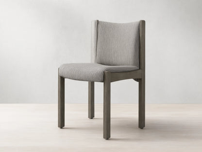 Paradiso Dining Chair, dark gray oak frame with gray upholstered seat & backrest, featuring thin black vertical stripes.