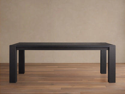 Parsons Dining Table crafted from dark Romanian oak wood with a rectangular top and thick rectangular legs, set on wooden floor.