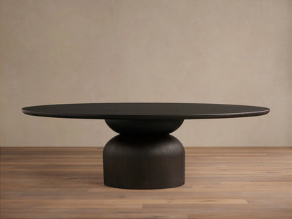 Dark wood Perth Oval Dining Table with an oval top and a sturdy, rounded pedestal base, resting on a wooden floor.