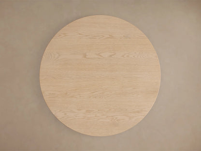 Close-up of the light natural wood Perth Bistro Table base, highlighting the vertical grain and two stacked rounded forms.