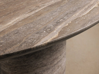 Close-up of the natural beige and brown travertine texture on the base of the Perth Oval Stone Dining Table.