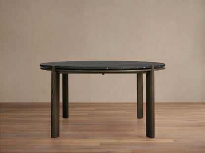 Round dining table with a dark Carrara marble top and solid red oak wood legs. The table has a minimalist design with a subtle sheen finish.