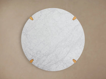 Round Pyet Dining Table with a white Carrara marble top and solid red oak wood base, showing natural grain and finish.